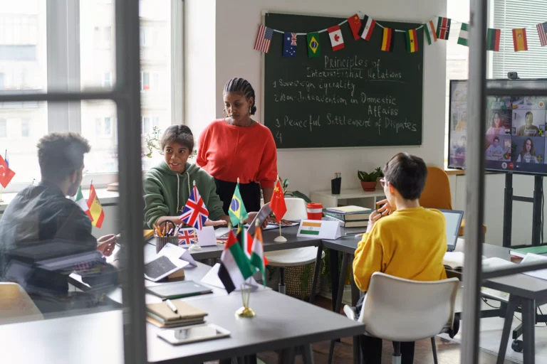 AnyConv.com__students-talking-to-teacher-in-the-classroom-2026-01-09-00-43-23-utc